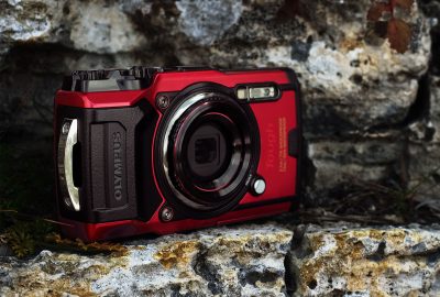 Product mockup image of the TG-6 Camera and accessories